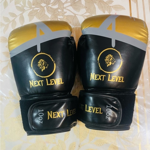 Other - Next Level boxing gloves Black and gold color Lion Logo 10 Oz